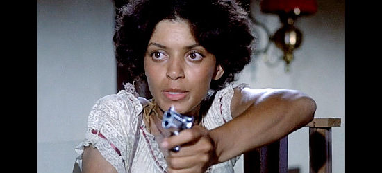 Vonetta McGee as Thomasine, helping Bushrod hold up a bank in Thomasine and Bushrod (1974)