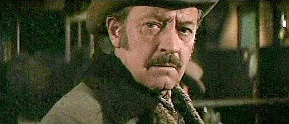 William Holden as Ross Bodine, the aging cowboy wondering about his future in Wild Rovers (1971)