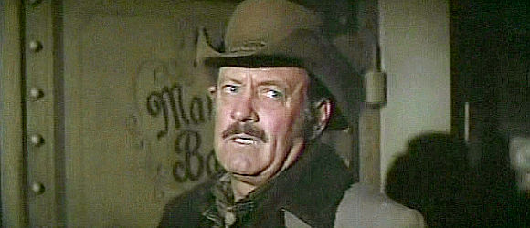William Holden as Ross Bodine, turning bank robber in Wild Rovers (1971)