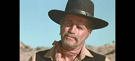 Charlton Heston as Sam Burgade, on the trail of Provo and Susan's kidnappers in The Last Hard Men (1976)