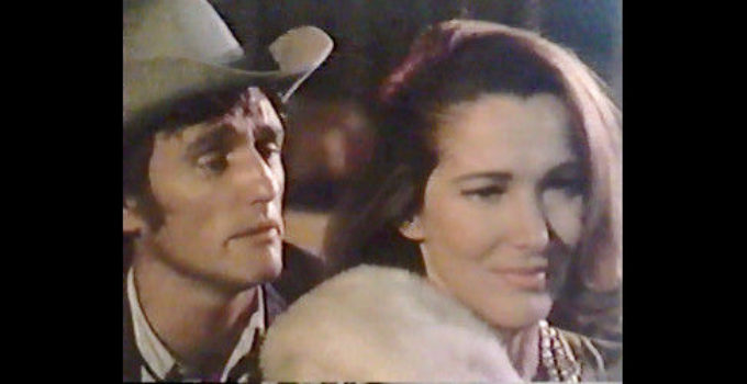 Dennis Hopper as Kansas, flirting with Mrs. Anderson (Julie Adams) in front of his girlfriend and her husband in The Last Movie (1971)