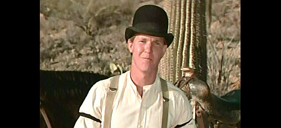 Larry Wilcox as Mike Shelby, assigned the job of protecting Susan's honor, for a while in The Last Hard Men (1976)