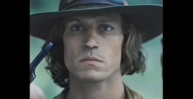 Michael Beck as Koda, under the gun of one of his enemies in Triumphs of a Man Called Horse (1983)