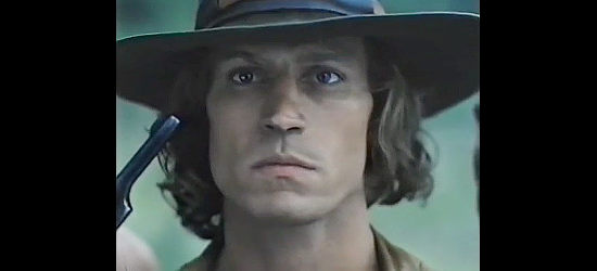 Michael Beck as Koda, under the gun of one of his enemies in Triumphs of a Man Called Horse (1983)