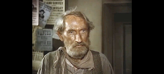 Arthur Hunnicutt as the sheriff, handing over another bounty to Kinkaid in The Bounty Man (1972)