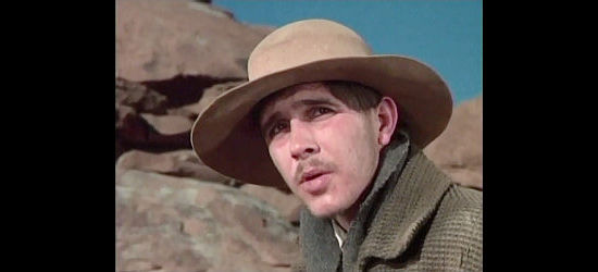 Barry Brown as Garratt, the young man who dreams of a new home in California with pretty Heller Chase in The Bravos (1972)