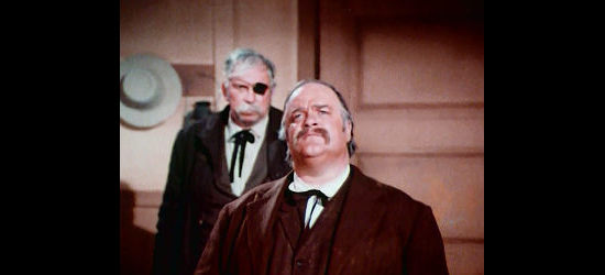 David Huddleston as Mr. Ross, asking the new preacher for a truce in Castle Walk in The Gun and the Pulpit (1974)