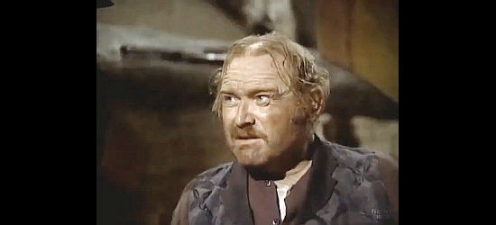 Gene Evans as Tom Brady, the store owner providing information on Billy Riddle's whereabouts in The Bounty Man (1972)