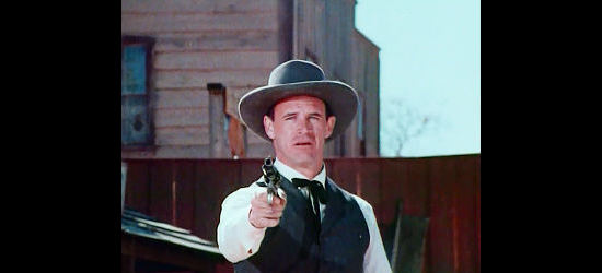 Geoffrey Lewis as Jason McCoy, Ross's hired gun, trying to do away with Ernie Parsons in The Gun and the Pulpit (1974)