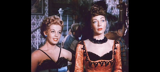 Jacqueline Fontaine as Ellen Larabee and Marie Windsor as Iron Mae McLeod, explaining Las Mujeres to a newcomer in Outlaw Women (1952)