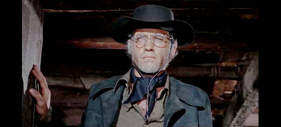 John Richardson as John Coler, on the lookout for trouble in Harland in Execution (1968)