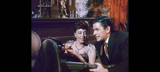 Marie Windsor as Iron Mae McLeod and Richard Rober as Woody Callaway find themselves partners in gunplay in Outlaw Women (1952)