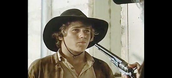 Stewart Peterson as Jimmie D. Richardson, meeting a stranger with a mean six-gun in Pony Express Rider (1976)