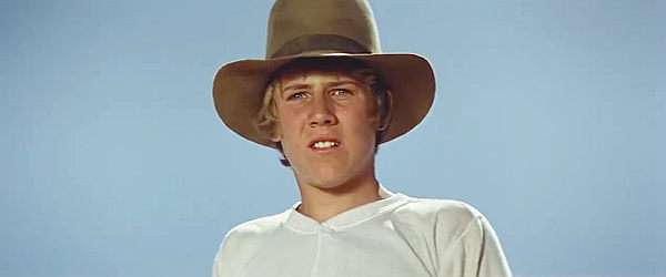 Stewart Peterson as Sam Sutter, contemplating a challenge that might save his sister's life in Against a Crooked Sky (1975)