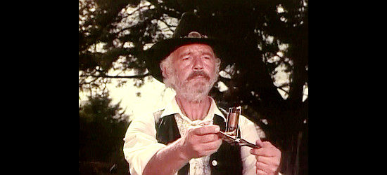 Terry Wilson as Utah Bravos, wondering why his belt buckle derringer isn't working in Fairplay (1971)