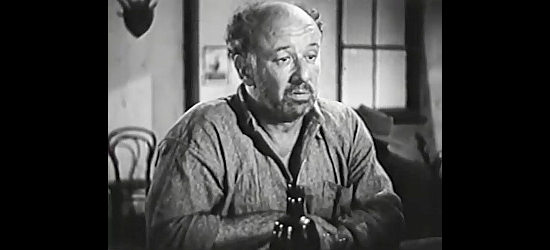 Alec Kellaway as Baldy Muldoon, Kinnane's fellow driver, trying to convince his wife he deserves one more drink in Kangaroo Kid (1950)
