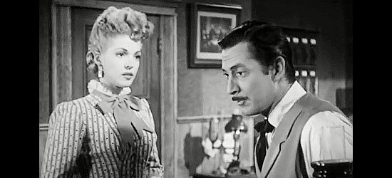 Anne Gwynne as June O'Carroll, considering a split with Matt Garson (Reed Hadley) in Panhandle (1948)