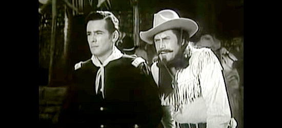 Charles Havey as Lt. George Bryan and Clayton Moore as Buffalo Bill on the watch for trouble in Buffalo Bill in Tomahawk Territory (1952)