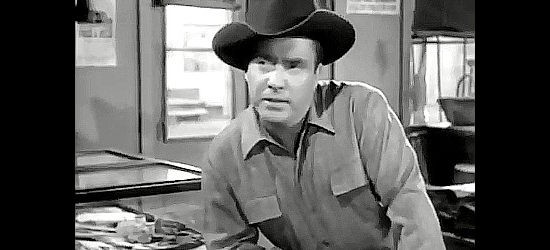 Edmond O'Brien as Ben Anthony, forming a partnership with store owner Joe Davis in Cow Country (1953)