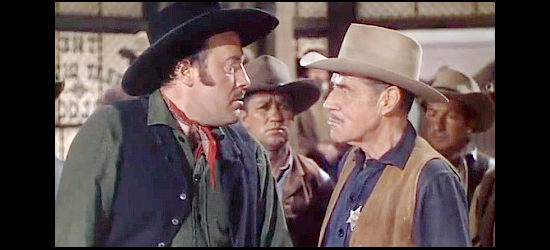 Fred Clark as Ryan, a critic of Sheriff Sam Barrett (Jack Holt) debates him over the pursuit of his son Logan in Return of the Frontiersman (1950)