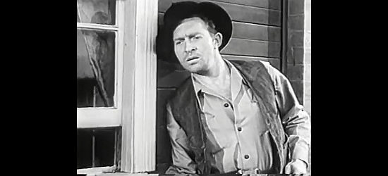 Grant Taylor as Phil Romero, Moller's main henchman, doing some snooping of his own in Kangaroo Kid (1950)