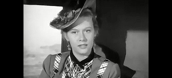 Helen Westcott as Linda Garnet, returning home from the Boston conservatory of music to help her father in Cow Country (1953)