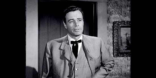 House Peters Jr. as Ralph Carruthers, the man who winds up wearing a badge when Joe Daniels refuses in Kansas Territory (1952)