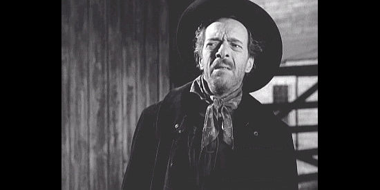 I. Stanford Jolley as Jack Perry, his suspicions aroused by two riders in Rebel City (1953)