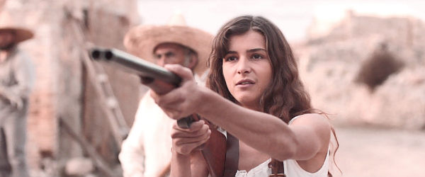 Isabella Walker as Clarissa Hawkins, about to settle a score in Gunfight at Dry River (2021)