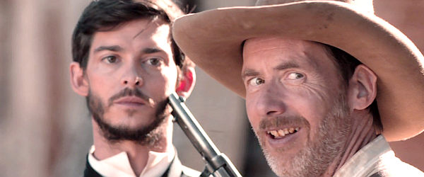 Morgan Symes as Reid Ryles, looking for permission to finish off Alonzo Murrieta (Joshua Dickinson) in Gunfight at Dry River (2021)