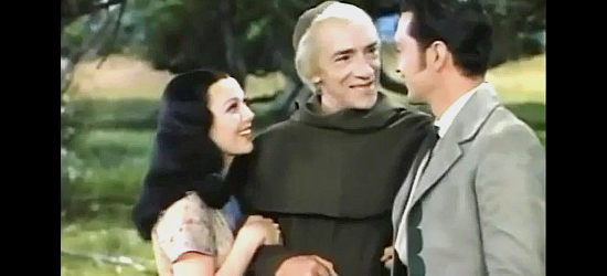 Pedro de Cordoba as Father Salvierderra, welcomed to the Moreno hacienda by Ramona (Loretta Young) and Felipe (Kent Taylor) in Ramona (1936)