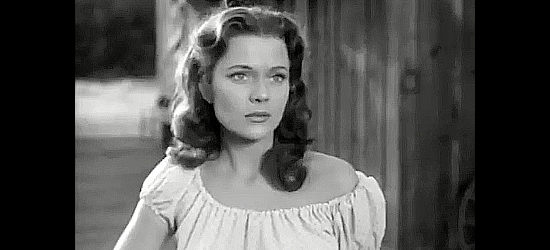 Peggie Castle as Melba Sykes, a nester's daugther who hopes marriage to Harry Odell will improve her life in Cow Country (1953)
