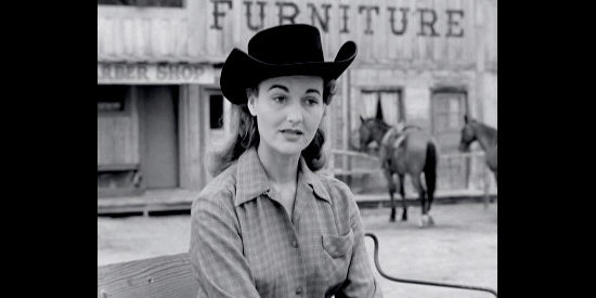 Peggy Stewart as Kay Collins, admitting she was once engaged to Joe Daniels' brother in Kansas Territory (1952)