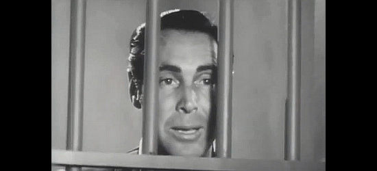 Philip Reed as Carlso Del Rio, locked in jail where no one knows he's really Joaquin Murietta in Bandit Queen (1950)