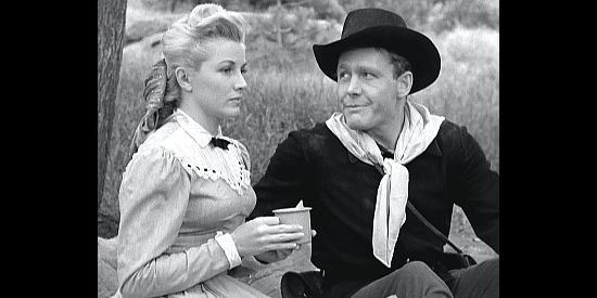 Phyllis Coates as Della Watson, fending off the advances of Sgt. Frick (Myron Healey) in The Maverick (1952)