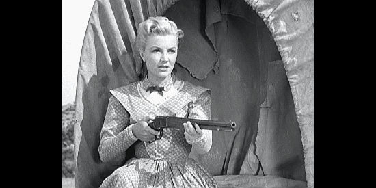 Phyllis Coates as Della Watson, wary of approaching riders in The Maverick (1952)