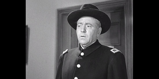 Ray Walker as Col. Barnes, questioning Graham about Greeley's murder in Rebel City (1953)
