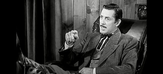 Reed Hadley as Matt Garson, talking about the trouble John Sands could cause in Sentinel in Panhandle (1948)
