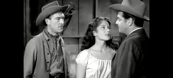 Roby Mallinson as Tim Sykes confronting Harry Odell (Robert Lowery) about his relationship with daughter Melba (Peggie Castle) in Cow Country (1953)