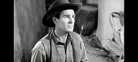 Rod Cameron as John Sands, stunned by news of his brother's death in Panhandle (1948)