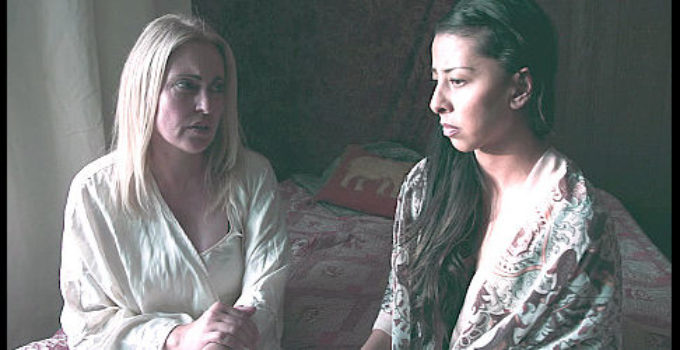 Sandy Penny as Victoria Bonham and Jessica V. Martin as Regina Silva discuss justice and vengeance in Badland Doves (2021)