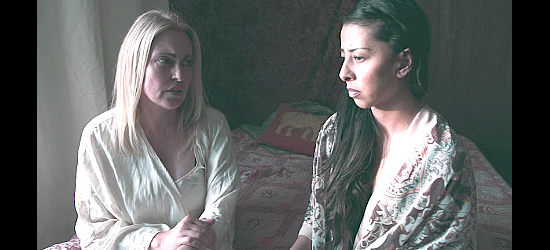 Sandy Penny as Victoria Bonham and Jessica V. Martin as Regina Silva discuss justice and vengeance in Badland Doves (2021)