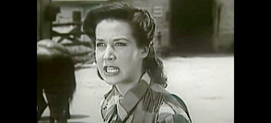 Sharon Dexter as Janet Walker, demanding answers about the Indian attacks in Buffalo Bill in Tomahawk Territory (1952)