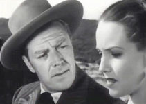 Willard Parker as Dan Hinsdale, finding himself falling for Lola Belmont without knowing her true identity in Bandit Queen (1950)