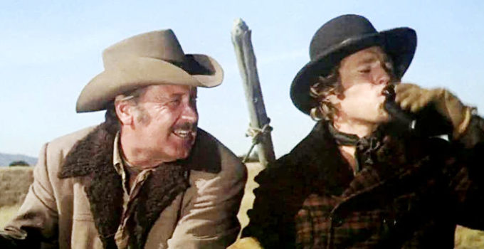 William Holden as Ross Bodine with_ Ryan O’Neal as Frank Post in Wild Rovers (1971)