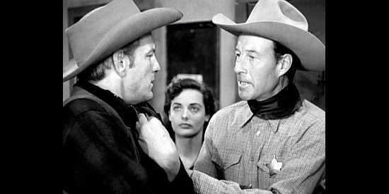 Bill Elliott as Sheriff Tack Hamlin, trying to get information out of a prisoner named Sperry (Denver Pyle) in Vigilante Terror (1953)