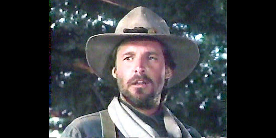 Bruce Boxleitner as Scott Collins, embarking on a journey to find his son in Down the Long Hills (1986)
