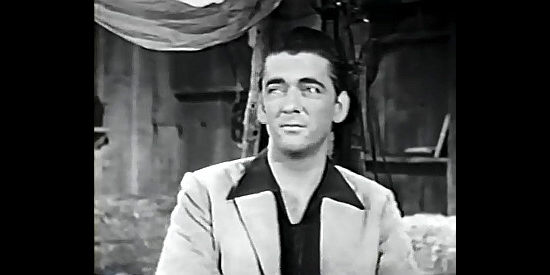 Carl Smith as himself, on the watch for trouble at a barn dance in Buffalo Gun (1961)