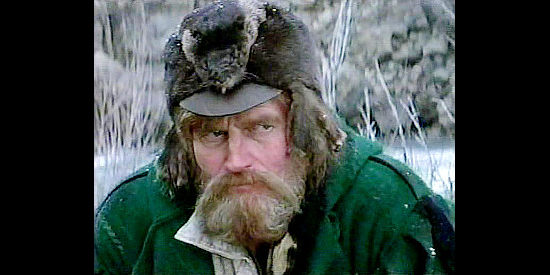 Charlton Heston as Bill Tyler, searching for furs and finding love with a captured Indian woman in The Mountain Men (1980)