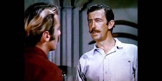 Chips Rafferty as Trooper Leonard, boasting to Connor about a colleague's tracking skills in Kangaroo (1952)